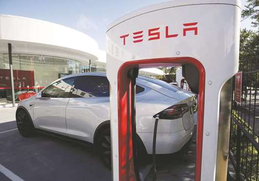 A Tesla Model X vehicle is charged by a supercharger outside an electric car dealership in Sydney. In its benchmark annual Energy Outlook, BP forecast a 100-fold growth in electric vehicles by 2040, with its chief economist Spencer Dale painting a world in which we travel much more but instead of using private cars, we increasingly share trips in autonomous vehicles.