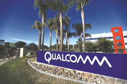 A sign of Qualcomm is seen at its campus in San Diego, California. The US chipmaker raised its offer to buy NXP Semiconductors to $127.50 per share yesterday.
