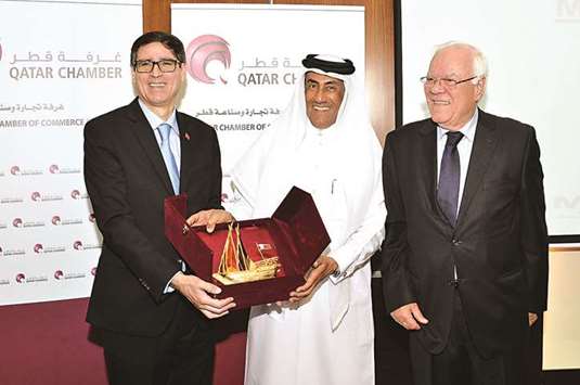 Qatar Chamber Board member Ali Abdullatif al-Misnad and Asmex president Hassan el-Sentissi el-Edrissi during the awarding of tokens at the Chamberu2019s headquarters in Doha yesterday.