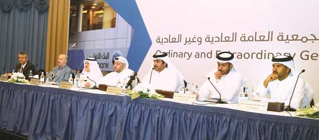 Sheikh Faisal, along with other board members, addressing the shareholders in Doha yesterday.
