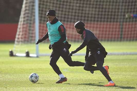 Manchester Unitedu2019s English striker Marcus Rashford (left) and Manchester Unitedu2019s English midfielder Ashley Young take part in a team training session at the clubu2019s training complex near Carrington, west of Manchester in north west England, on the eve of their Champions League round of 16 match against Sevilla. (AFP)