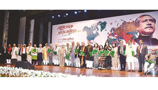 Bangladesh Prime Minister Sheikh Hasina with recipients of Ekushey Padak recipients in Dhaka yesterday.