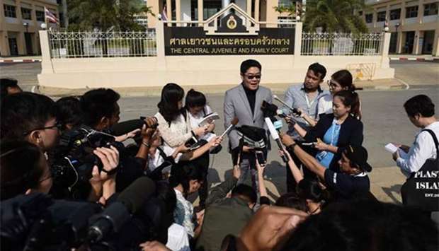Kong Suriyamontol, the Thai lawyer for Japanese national Mitsutoki Shigeta, speaks to the press after his client was granted paternity rights to his children, at a juvenile court in Bangkok on Tuesday.