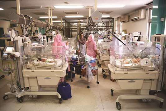 Nurses take care of newborn babies at the neonatal intensive care unit of Pakistan Institute of Medical Sciences (PIMS) in Islamabad yesterday.