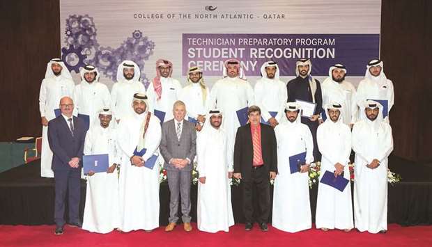 The graduates with officials.
