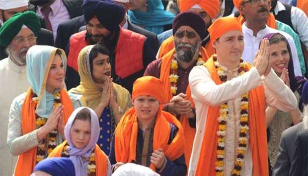 Canadian Prime Minister Justin Trudeau along with his wife Sophie Gregoire and their children Ella-Grace and Xavier pay respects at the Golden Temple in Amritsar on Wednesday.