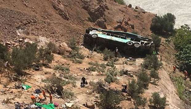 A bus is seen after run off the road and plunged into a ravine on the Panamerican road in southern P