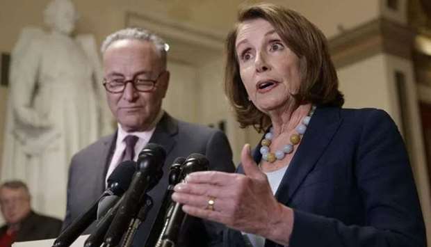 Senate Democratic Leader Chuck Schumer (L) and House of Representatives Democratic Leader Nancy Pelosi asked that the additional funds be included in a bill to fund the government