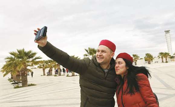 British tourists takes a selfie after arriving to Tunisia with the Thomas Cook travel agency at the Enfidha Airport in Enfidha, Tunisia, on February 14. Tourism accounts for 8% of Tunisiau2019s gross domestic product.