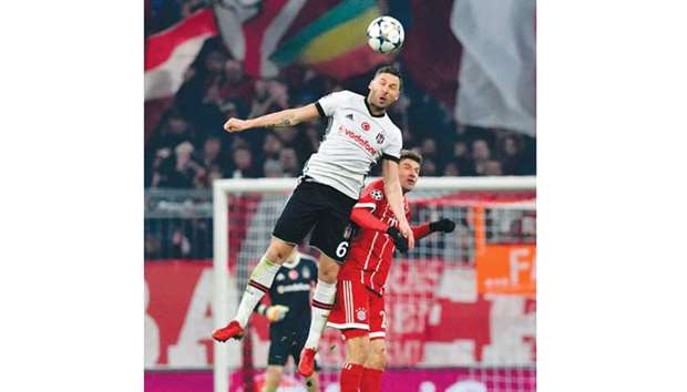 Besiktasu2019 Dusko Tosic (left) and Bayern Munichu2019s Thomas Mueller vie for the ball during the Champions League match. (AFP)