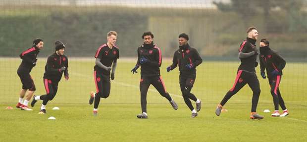 Arsenal players train in London yesterday. (Reuters)