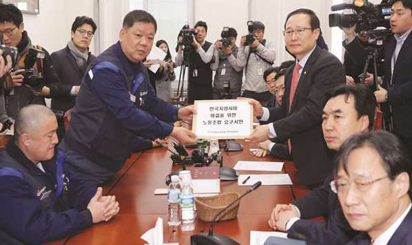 GM Koreau2019s labour union leaders deliver a letter to Hong Young-pyo, a ruling party lawmaker from Bupyeong, where GM Koreau2019s biggest factory is based, demanding the normalisation of the firmu2019s operation, in the National Assembly in Seoul. GM had asked South Korea to inject funds into GM Korea through Korea Development Bank, a source said.
