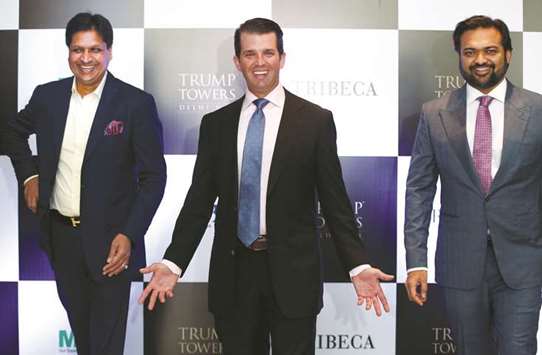 Donald Trump Jr gestures as Basant Bansal, chairman and managing director of M3M India and Kalpesh Mehta, founder of Tribeca Developers, look on during a photo opportunity before start of a meeting in New Delhi on Tuesday. Trump Jr said new business would take a hit in India.