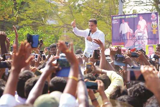 Kamal Haasan speaks at a public rally where he announced the launch his party, in Madurai yesterday.
