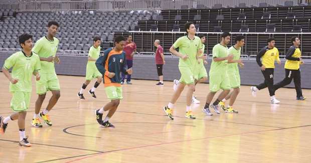 Qataru2019s schools handball team train at Ali Bin Hamad al-Attiyah arena yesterday.