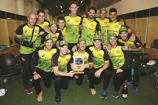 Australiau2019s players celebrate after winning the Twenty20 tri-series in Auckland. (AFP)