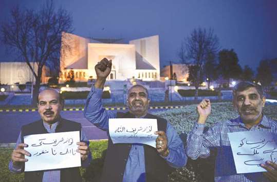 Supporters of ousted prime minister Nawaz Sharif chant slogans against a court verdict in front of the Supreme Court building in Islamabad yesterday.