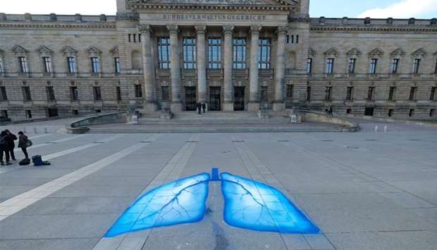 Environmental activists have painted lungs in front of the Federal Administrative Court in Leipzig, eastern Germany