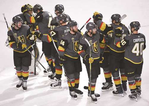 Vegas Golden Knights players celebrate after defeating the Calgary Flames 7-3 at T-Mobile Arena in Las Vegas. PICTURE: USA TODAY Sports