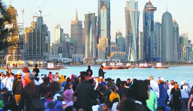 People take part in the Qatar National Day celebrations in Doha on December 18, 2017. Qatar's economy has remained resilient in the face of the blockade, according to Washington-based IIF.