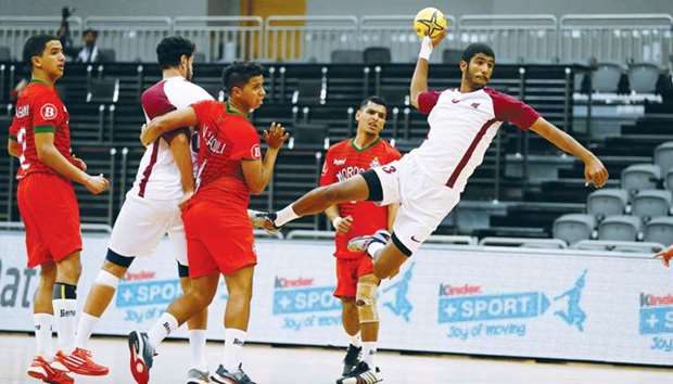 A Qatar player scores during the win over Morocco in the ISF World Schools Handball Championship at Ali Bin Hamad Al Attiyah Arena yesterday.