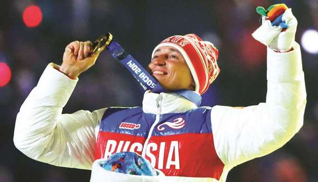 In this February 23, 2014, picture, Russian gold medallist Alexander Legkov celebrates as he receives his medal for the cross-country 50km mass start race at the Sochi 2014 Winter Olympics. Legkov is now eligible to compete in Pyeongchang. (Reuters)