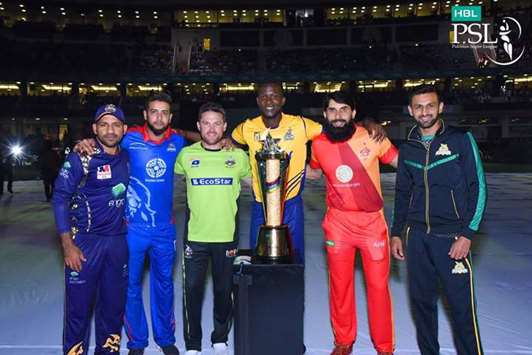 Team captains pose with Pakistan Super League trophy in Dubai yesterday.