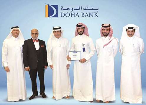 Doha Bank Group CEO Dr R Seetharaman and other officials with an awardee.