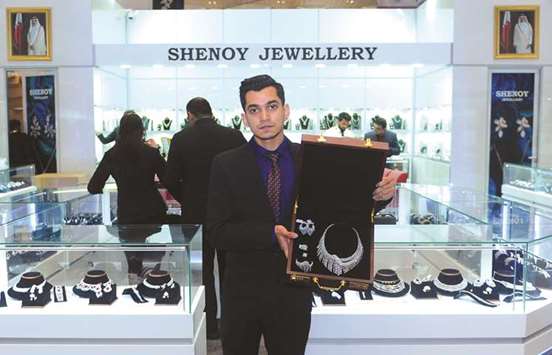 Sanjay Shenoy shows a diamond set, consisting of necklace, bracelet, rings and earrings at Shenoy Jewellery at Pari Gallery pavilion at Doha Jewellery and Watches Exhibition yesterday. PICTURE: Shemeer Rasheed