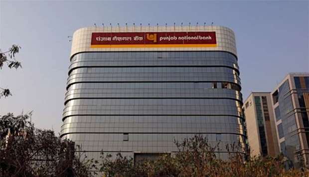 The logo of Punjab National Bank is seen on the facade of its office in Mumbai.
