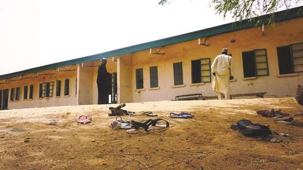 Sandals are strewn in the yard of the Government Girls Science and Technical College staff quarters in Dapchi, Nigeria.