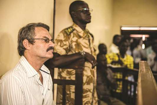 A former South African soldier William Endley, 55, who was hired in 2016 to advise former vice president and rebel leader Riek Machar looks on as he attends his trial in a courtroon at Jubau2019s courthouse, South Sudan, yesterday.