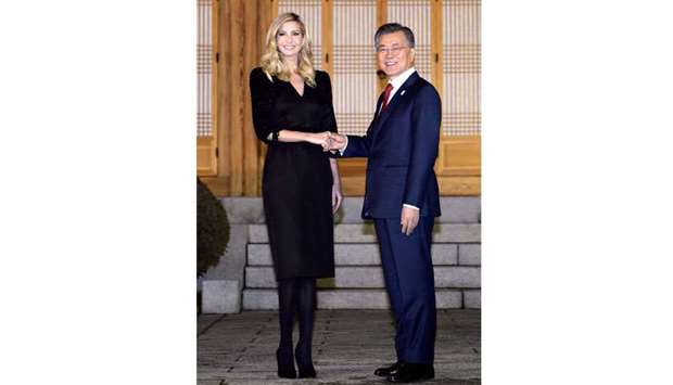 South Korean President Moon Jae-in shakes hands with Ivanka Trump during their dinner meeting at the Presidential Blue House in Seoul yesterday.