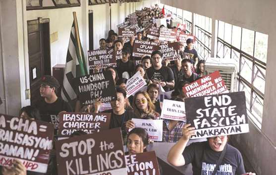 Students of University of the Philippines (UP) participate during a mass walkout to denounce what they call President Rodrigo Duterteu2019s u201crising dictatorshipu201d in Manila, yesterday.