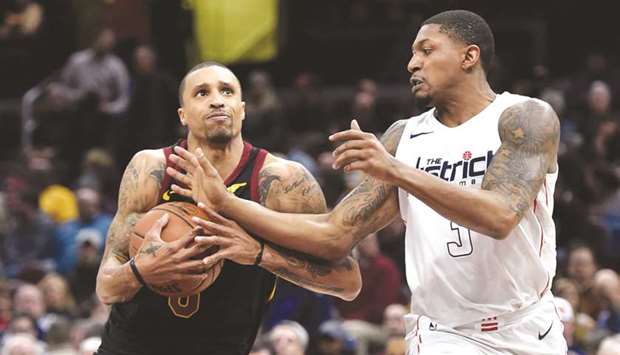 Cleveland Cavaliersu2019 George Hill (left) drives against Washington Wizardsu2019 Bradley Beal during the NBA game in Cleveland on Thursday. (USA TODAY Sports)