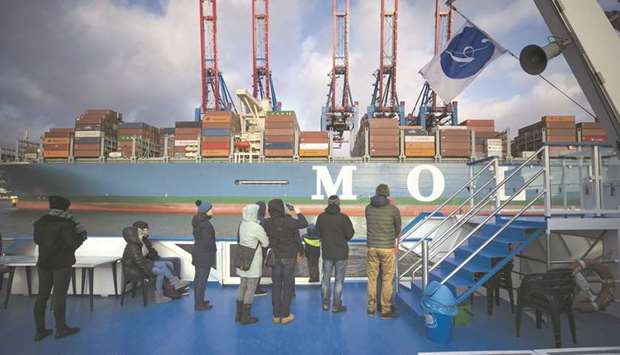 Passengers on a tourist boat look out towards the Mol Truth container vessel docked at the Hamburger Hafen und Logistik Container Terminal Burchardkai in the Port of Hamburg. The Federal Statistics Office said exports, which have traditionally propelled the German economy, climbed by 2.7% on the quarter and imports rose by 2.0% so net trade contributed 0.5 percentage points to growth.