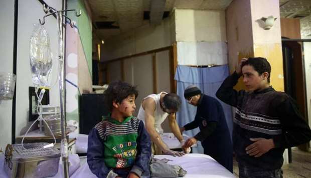 Wounded children are seen in a hospital in the besieged town of Douma, Eastern Ghouta, Damascus