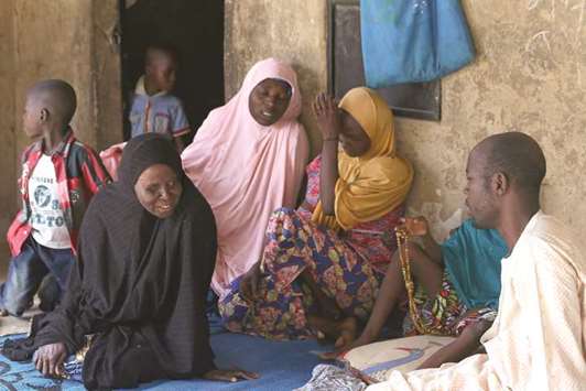 Relatives of missing schoolgirls react in Dapchi in the northeastern state of Yobe, after an attack on the village by Boko Haram militants in Nigeria. More than 100 girls are reported missing after the Boko Haram school attack that President Muhammadu Buhari on Friday called a u201cnational disasteru201d. But locals in the remote town of Dapchi said they had been left vulnerable to attack because soldiers had been withdrawn in the last few weeks.