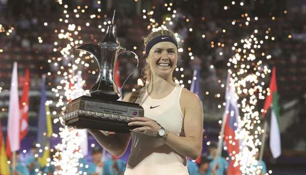 Elina Svitolina of Ukraine poses with trophy after winning the Dubai Open yesterday. (AFP)