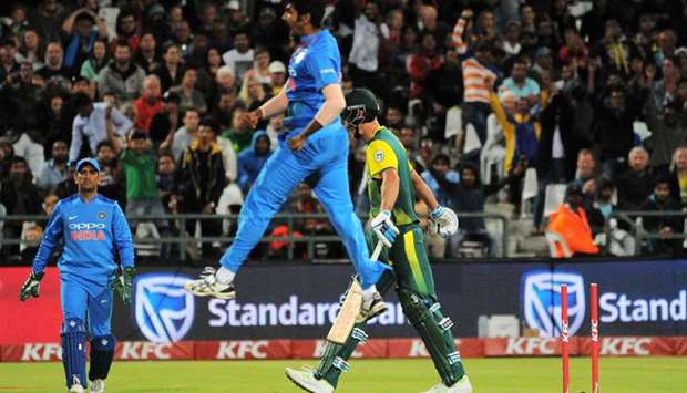 Indiau2019s Jasprit Bumrah (C) reacts after taking the wicket of South Africau2019s Chris Morris (R) during the third T20 international at the Newlands Cricket Ground in Cape Town yesterday.