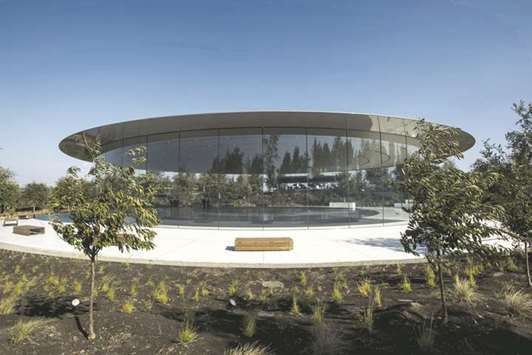 The Steve Jobs Theater stands on the Apple Inc campus after an event in Cupertino, California, in September 2017. Surrounding the building are  45-foot tall curved panels of safety glass. Inside are work spaces, dubbed u201cpods,u201d also made with a lot of glass.