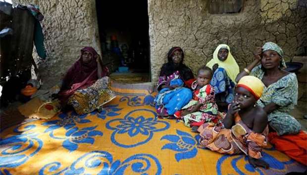 Relatives visit the mother of one of the abducted Dapchi students in Jumbam village, Yobe state on Saturday.