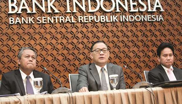 Indonesiau2019s central bank governor Agus Martowardojo (centre) speaks to reporters beside deputy governor Perry Warjiyo (left) and senior deputy governor Mirza Adityaswara at Bank Indonesia headquarters in Jakarta. Indonesian President Joko Widodo sent a letter to the parliament on Friday seeking approval for Warjiyo to be installed as the next Bank Indonesia chief, replacing incumbent Agus Martowardojo whose five-year term ends in May, sources said.