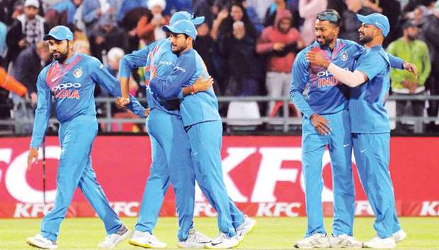 Indiau2019s players celebrate after winning the the T20 series against South Africa in Cape Town. (AFP)