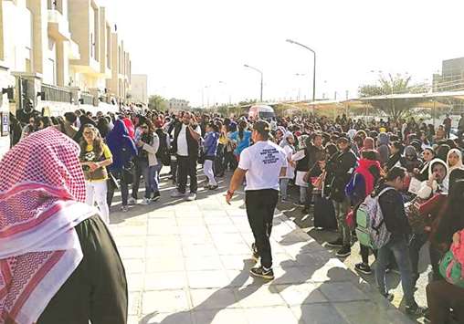 A handout photo released recently by the Kuwait Times newspaper shows Filipino workers trying to get amnesty waiting outside the Philippine embassy in Kuwait City.