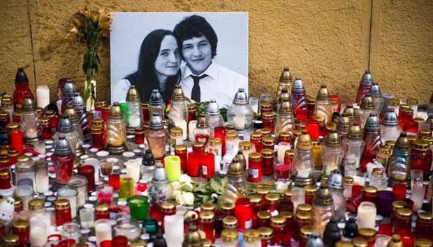 Hundreds of candles have been placed in front of a portrait of Slovak investigative journalist Jan Kuciak and his girlfriend Martina Kusnirova in the center of Bratislava.