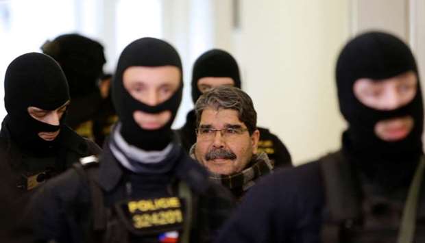 Kurdish Democratic Union Party (PYD) former leader Saleh Muslim is escorted to a Czech court, which will rule on his custody pending extradition proceedings requested by Turkey, in Prague, Czech Republic.