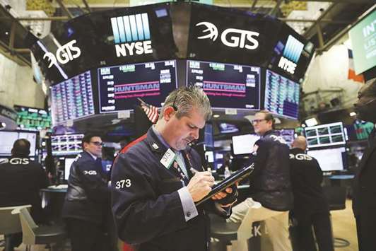 Traders work on the floor of the New York Stock Exchange (NYSE) on February 26 in New York City. As corporate profits continue to impress investors, stocks have been rising once again in recent weeks with the Dow Jones industrial average finishing the day up over 350 points.