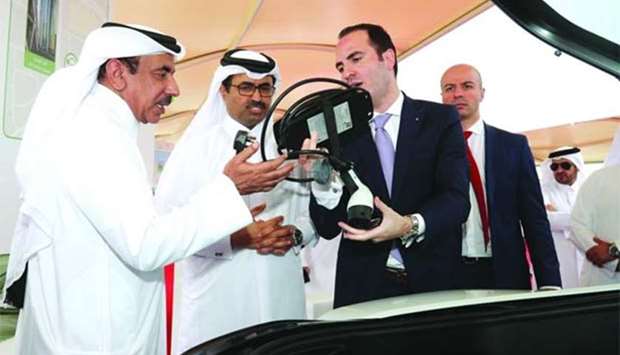HE the Minister of Energy and Industry Dr Mohamed bin Saleh al-Sada and HE the Minister of Transport and Communications Jassim Seif Ahmed al-Sulaiti at Kahramaa Awareness Park, where the country's first electric car charging station project was launched on Tuesday.