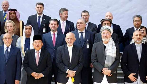 Afghan President Ashraf Ghani poses for a group photo during a peace and security cooperation conference in Kabul on Wednesday.